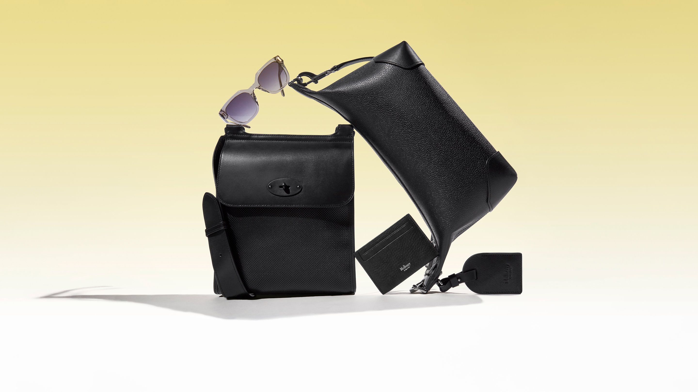 mulberry antony bag in black, belgrave sunglasses in grey, credit card slip in black and crossbody clipper bag in black